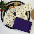 Beige embroidered garment with purple saree