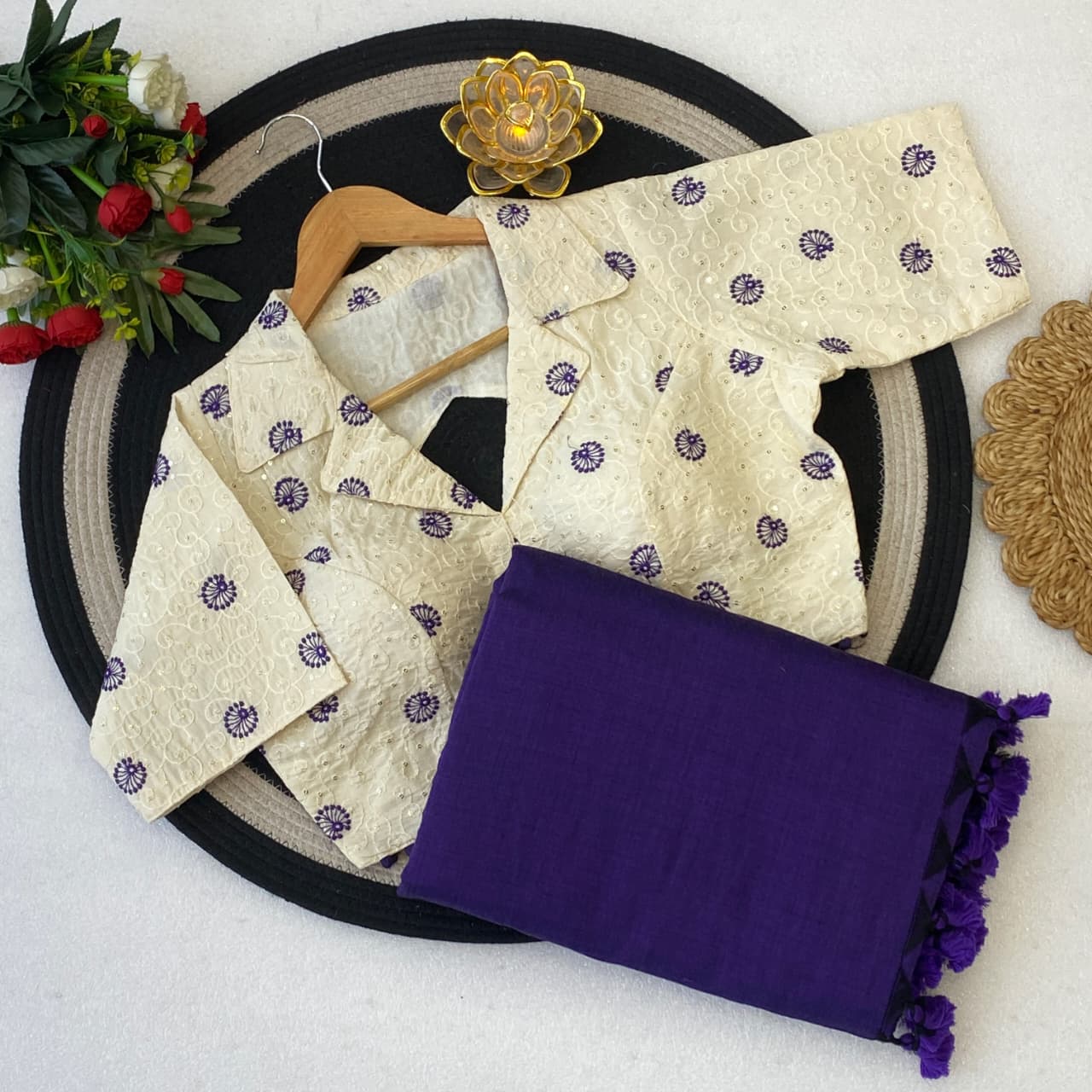 Beige embroidered garment with purple saree