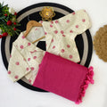 Beige blouse with red floral patterns and pink saree 