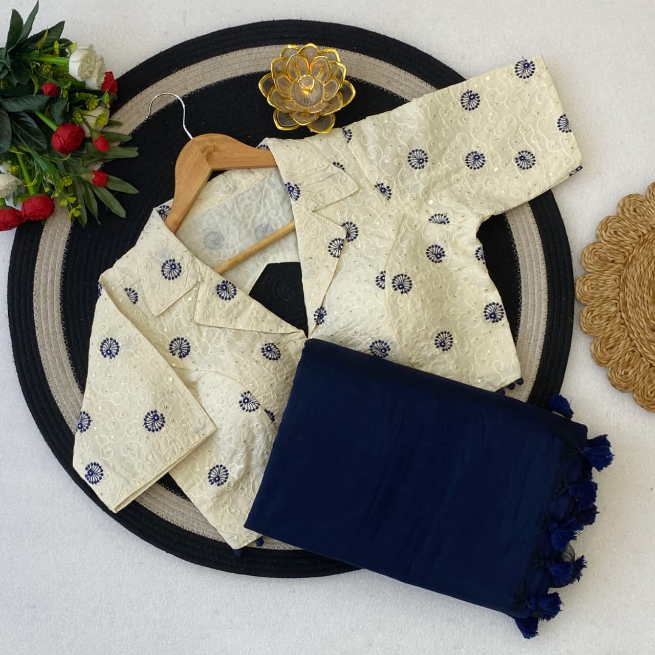 Beige embroidered blouse and navy blue saree 