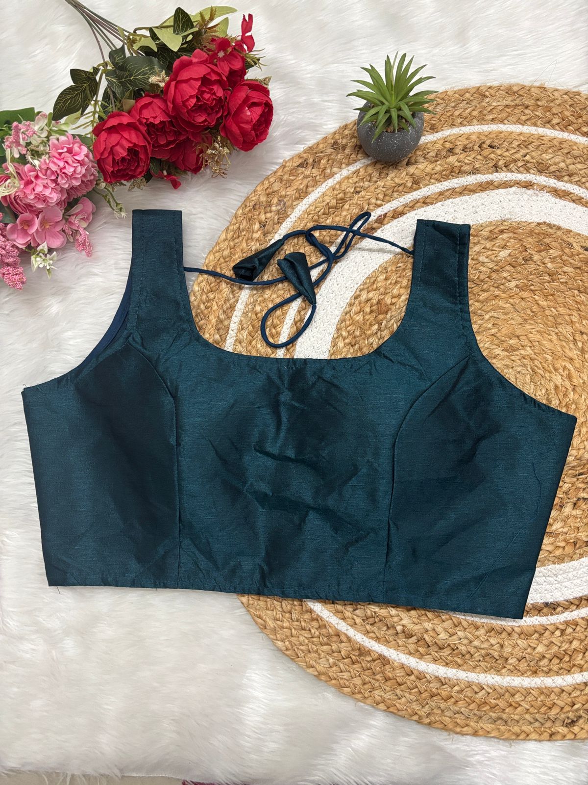 Half Teal  blouse with brown surace background