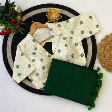 White embroidered blouse with green Saree